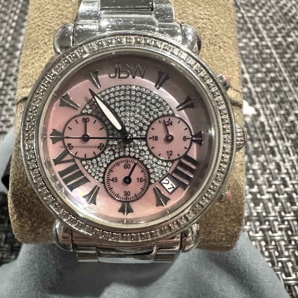JBW large ladies pink face with zirconias around face and on watch face.
